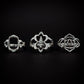 this image shows three rings from the presale collection. all sterling. they are lined up. first ring is an elongated hexagon center, the next looks like a flower design, and the last design is tribal. all three rings are symmetrical rings. black background